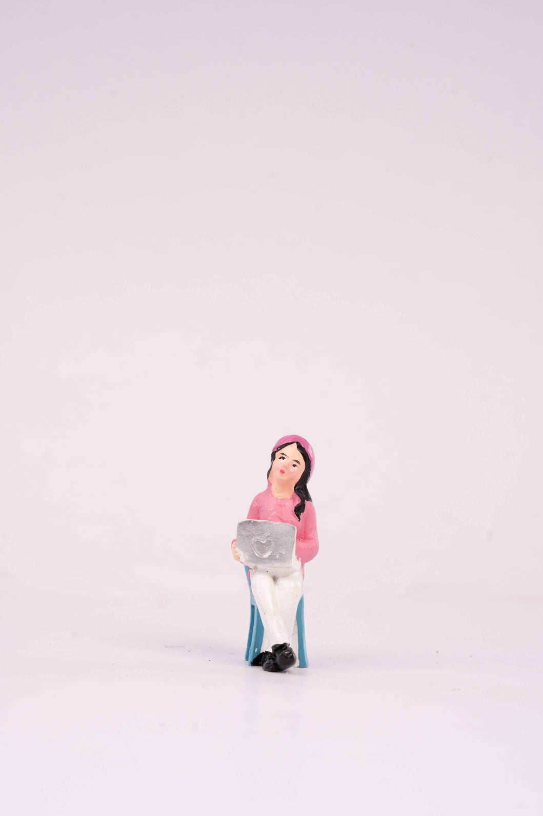 A girl with a laptop miniature