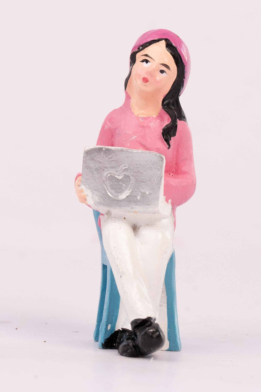 A girl with a laptop miniature