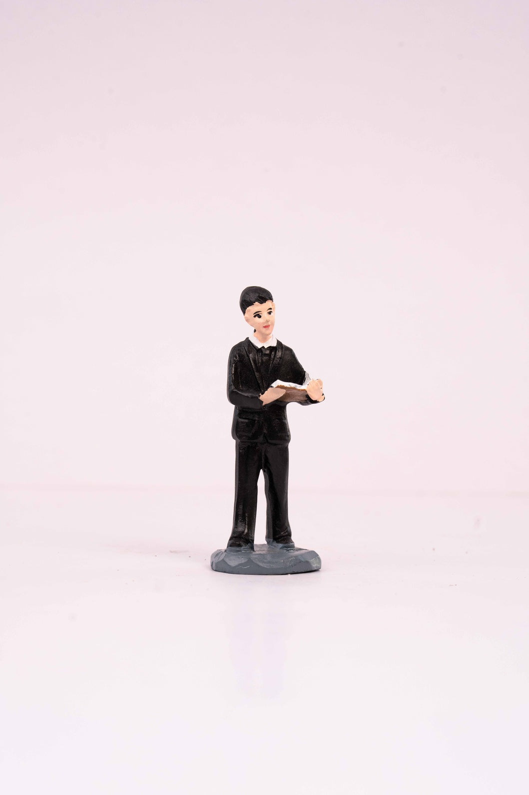 A Man Reading a Book Miniature